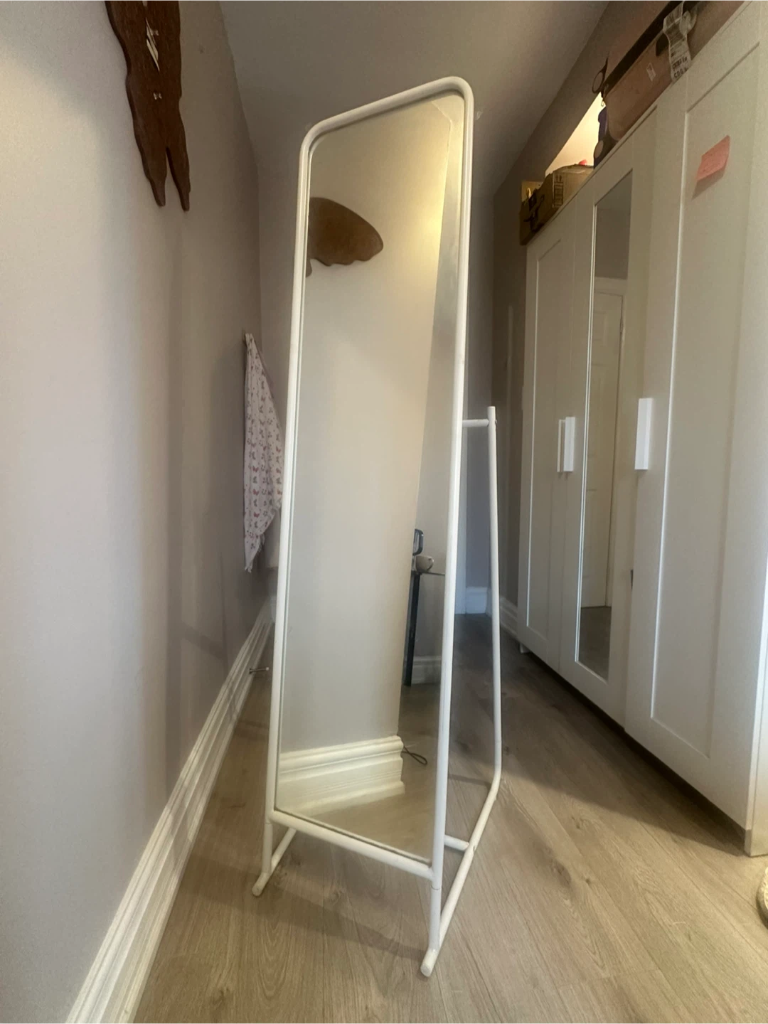 Moving out sale.White standing mirror with hooks