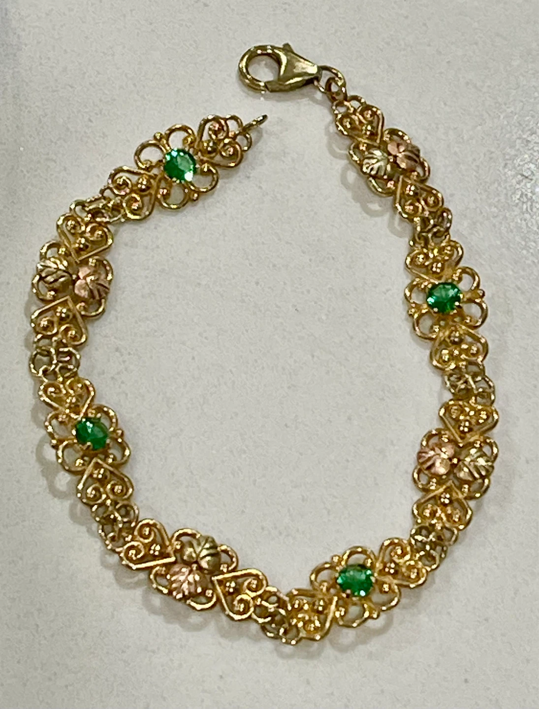 10k Gold Bracelet with emerald Green Stones