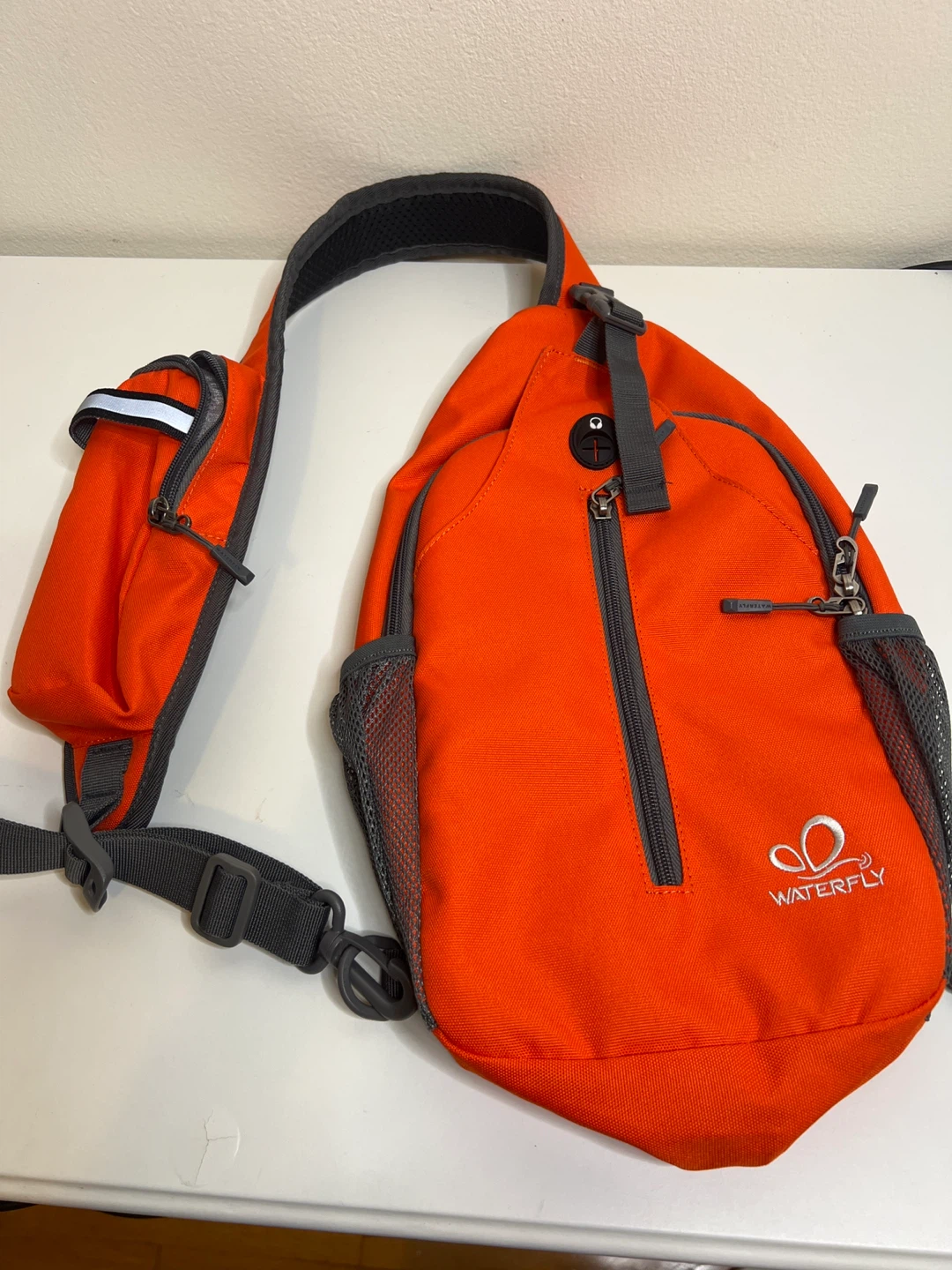 Orange WATERFLY Sling Backpack