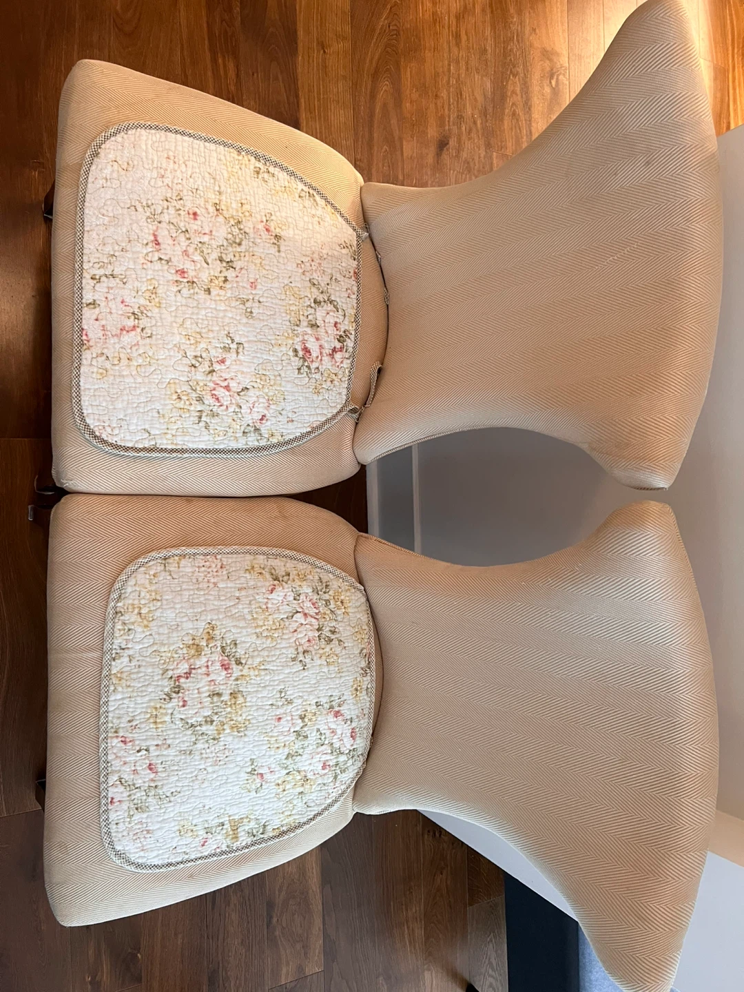 Two accent chairs with floral seat cushions