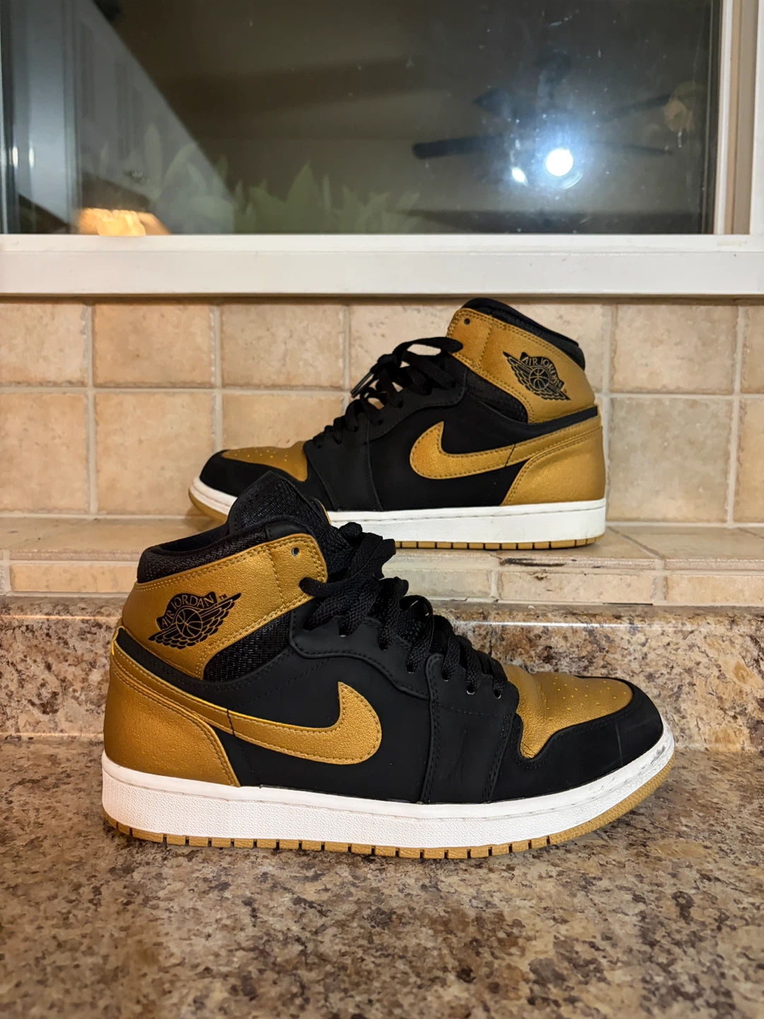Air Jordan 1 Mid Black Gold Sneakers