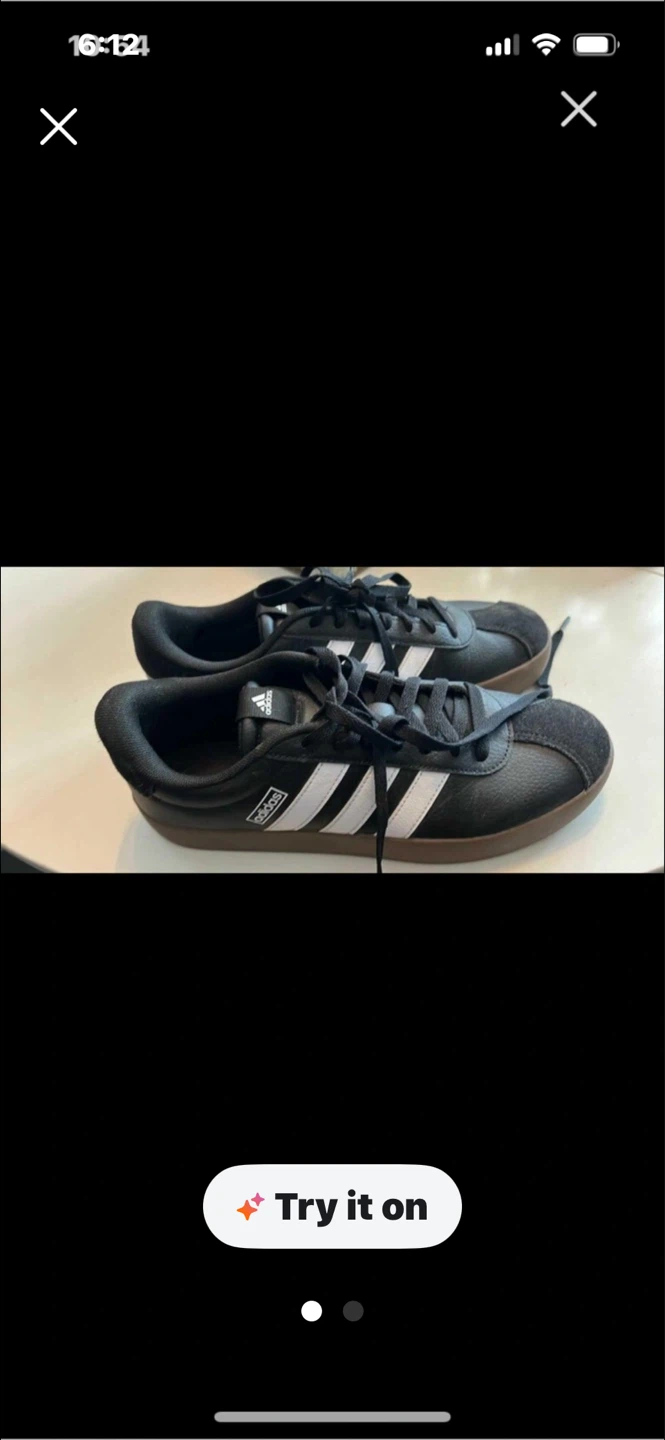 Adidas black sneakers with white stripes