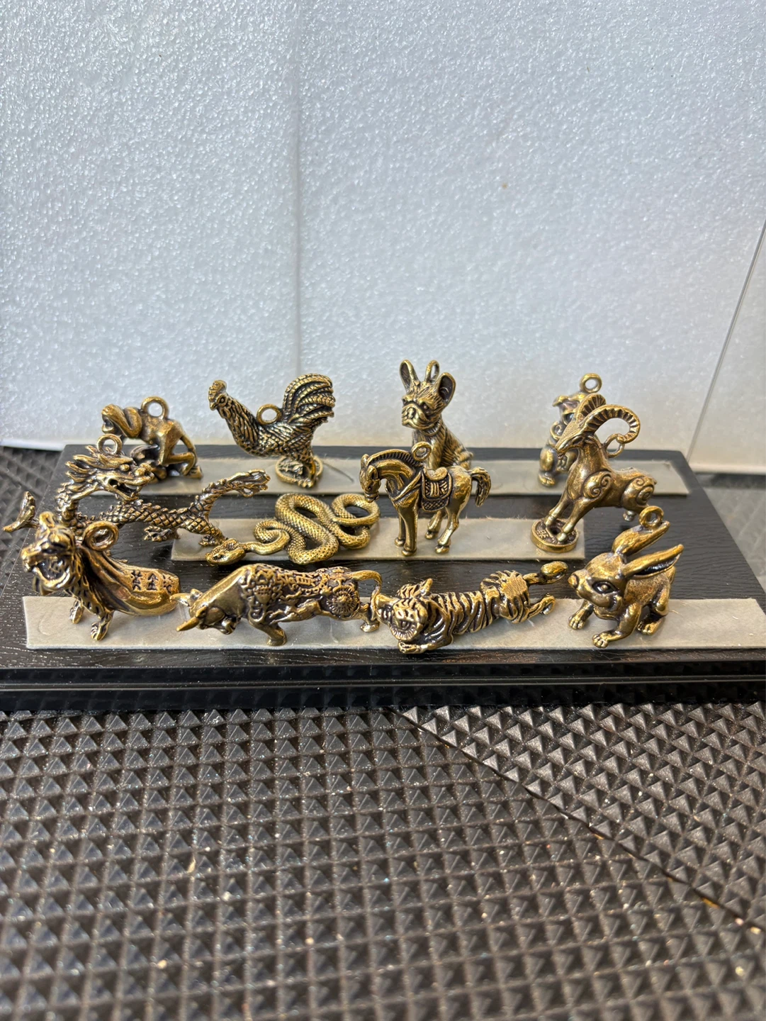 A set of 12 bronze Chinese zodiac animal pendants
