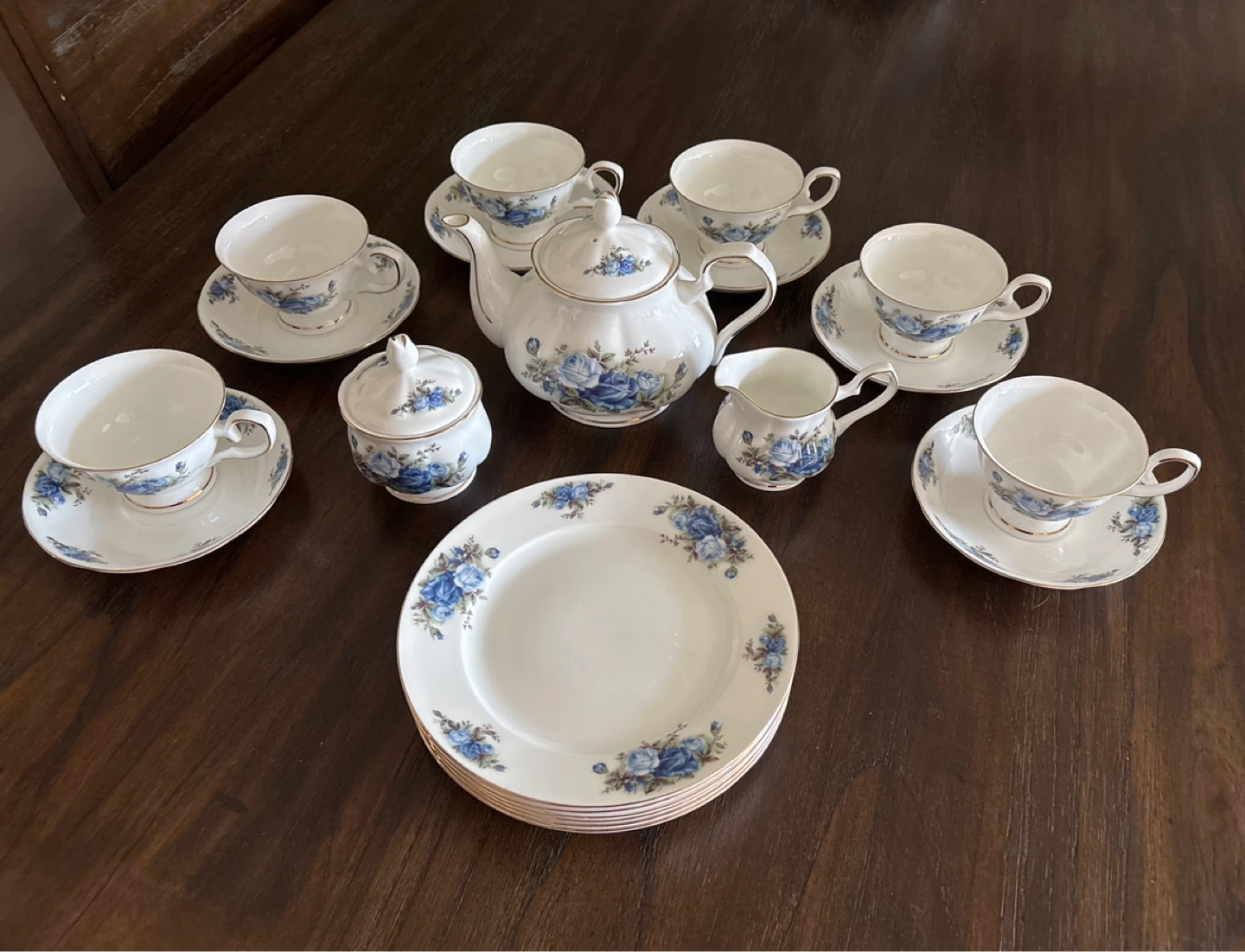 White Teacup and Saucer Set with Blue Roses