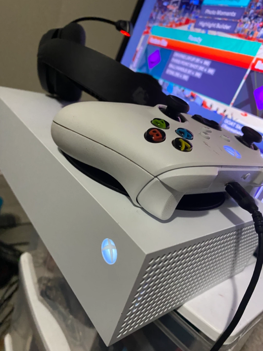 Xbox series s with controller, TV, and Bluetooth headset