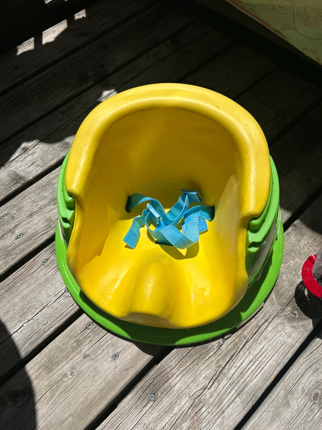 Yellow and Green Booster Seat with Blue Straps