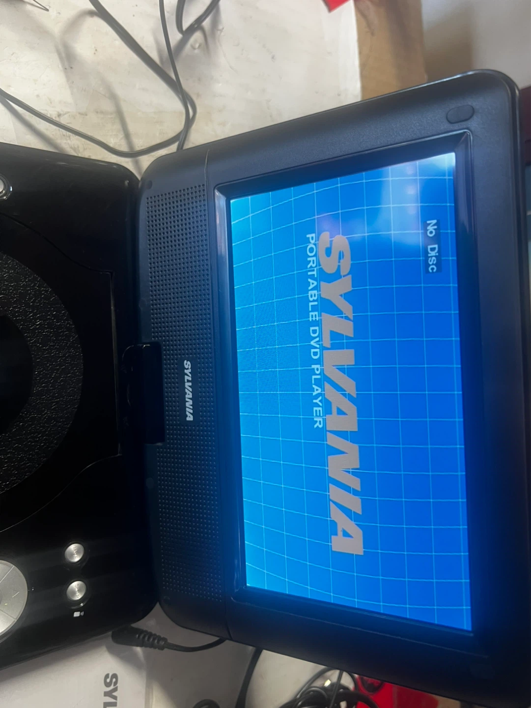 For sale sylvania DVD player with 4 DVDs movies free - photo 3