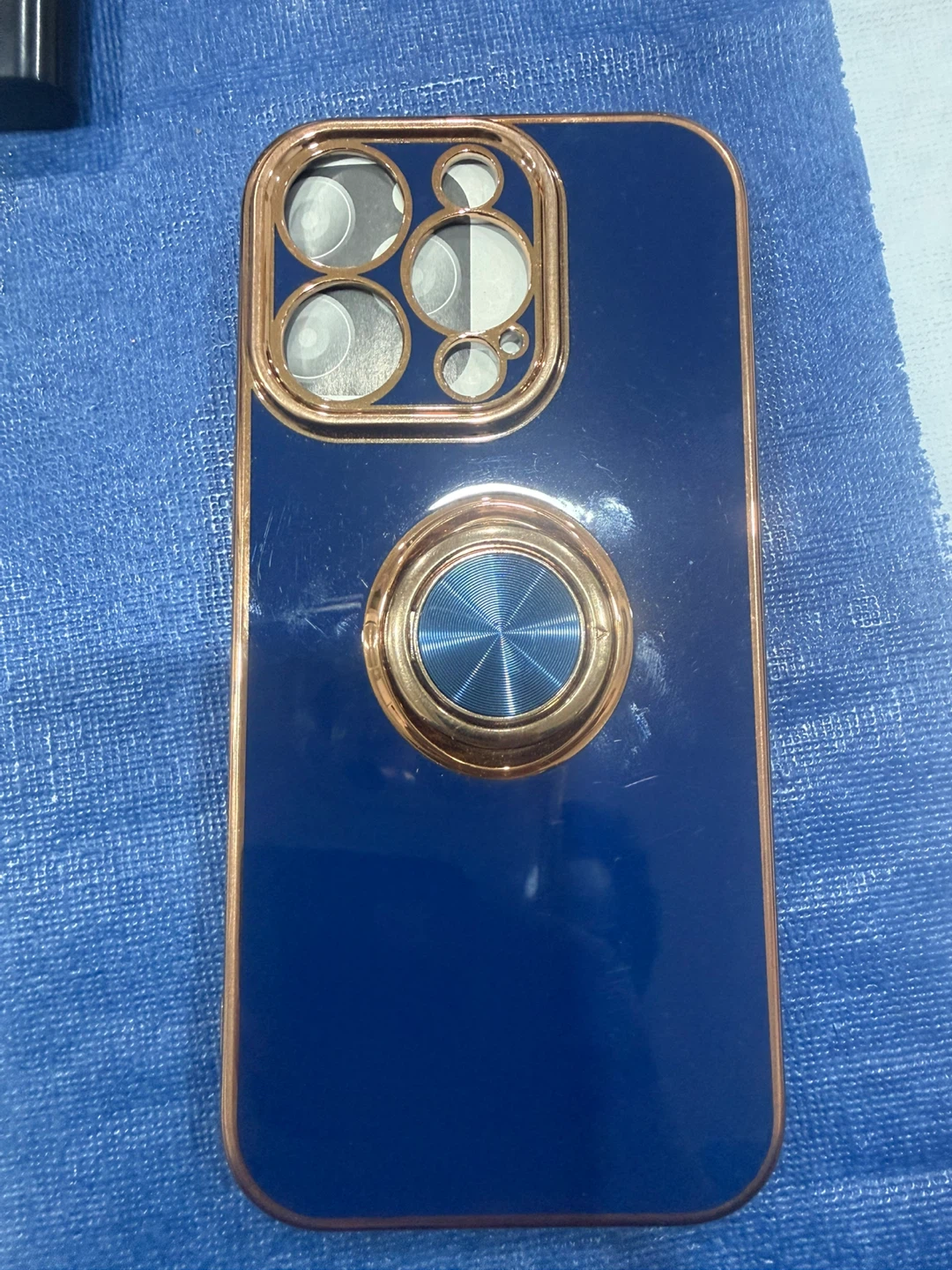Blue phone case with gold ring holder