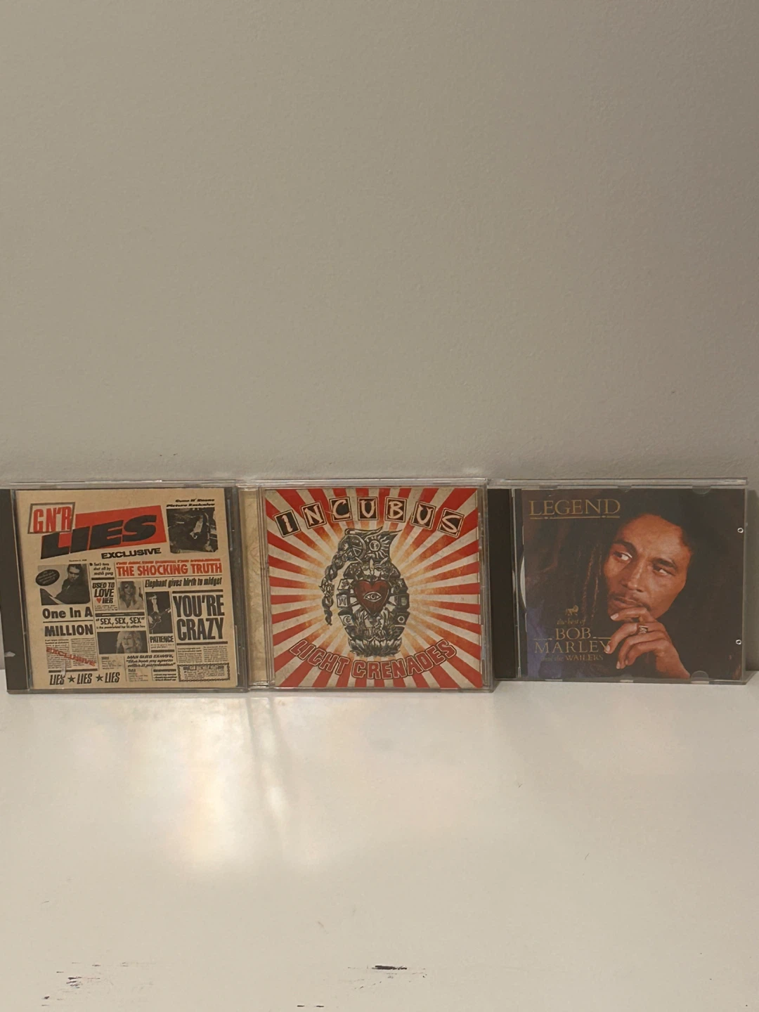 Guns N' Roses, Incubus, and Bob Marley CDs