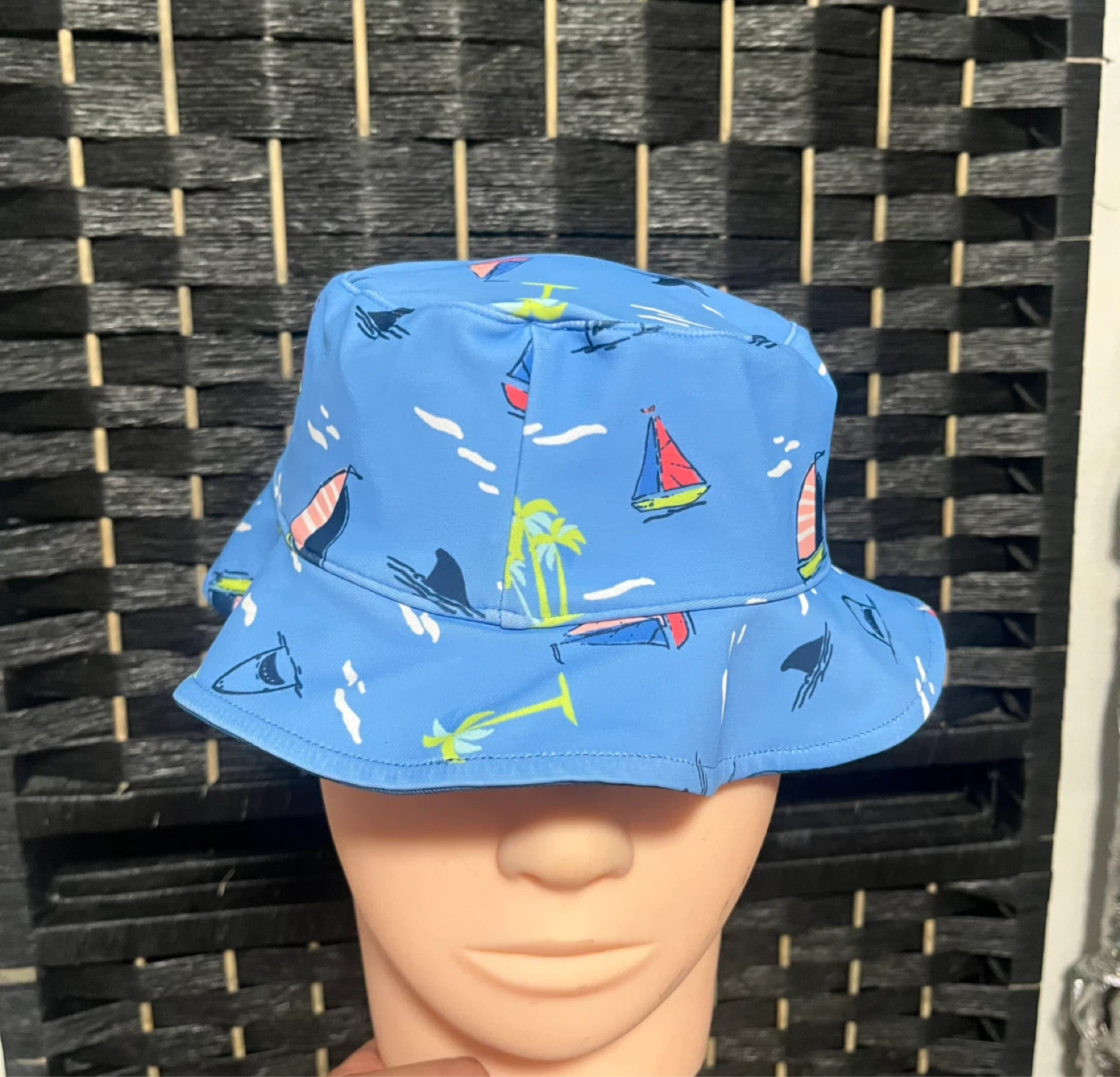 Blue bucket hat with sailboat print