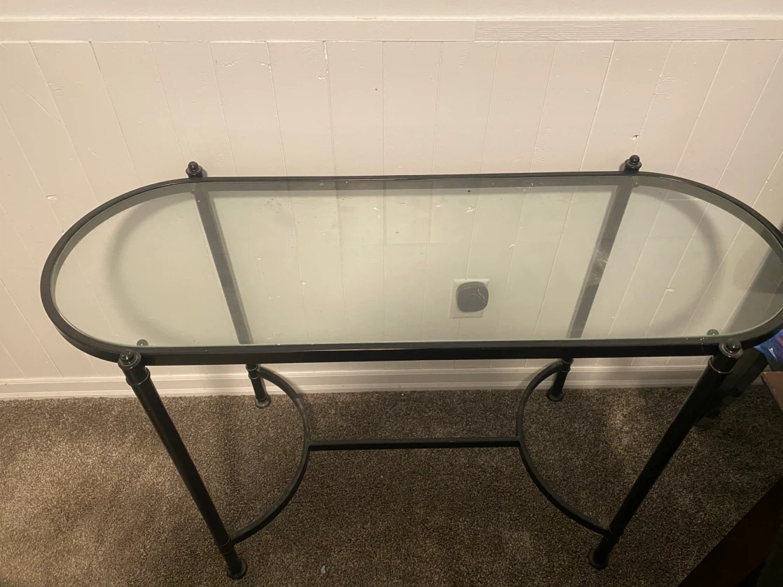 Glass top console table with black metal frame