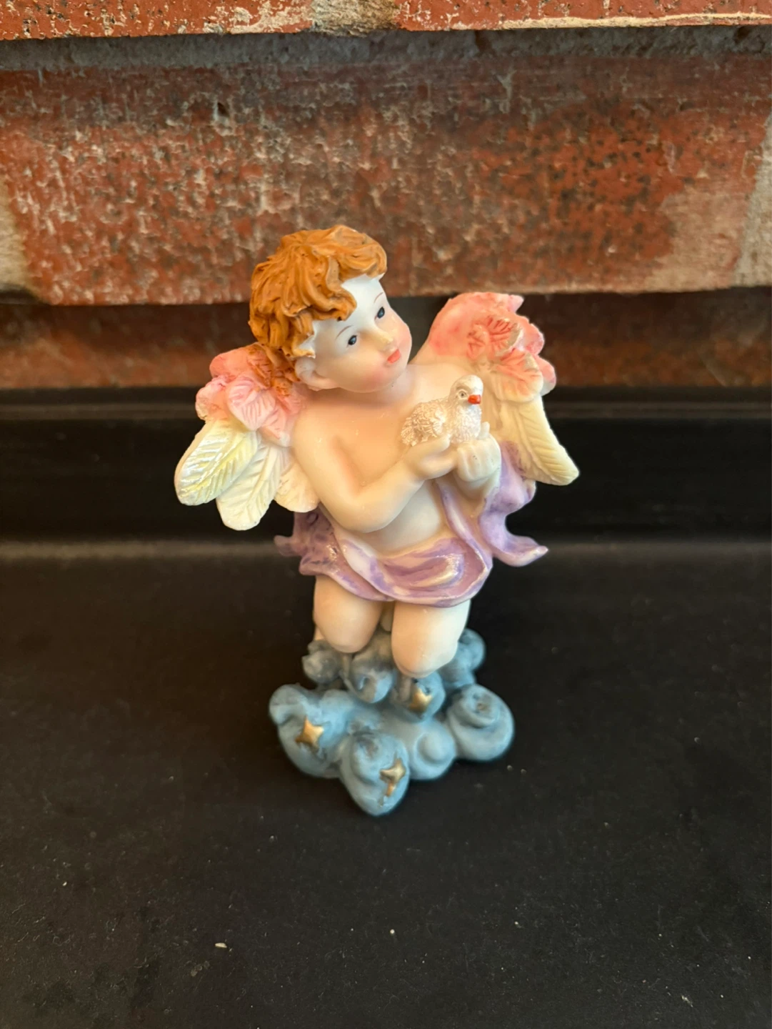 Cherub Figurine Holding Bird