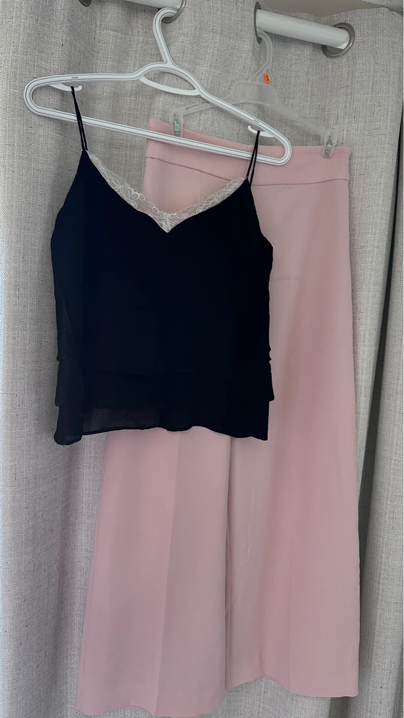 Black top with lace trim and pink pants all Zara.
