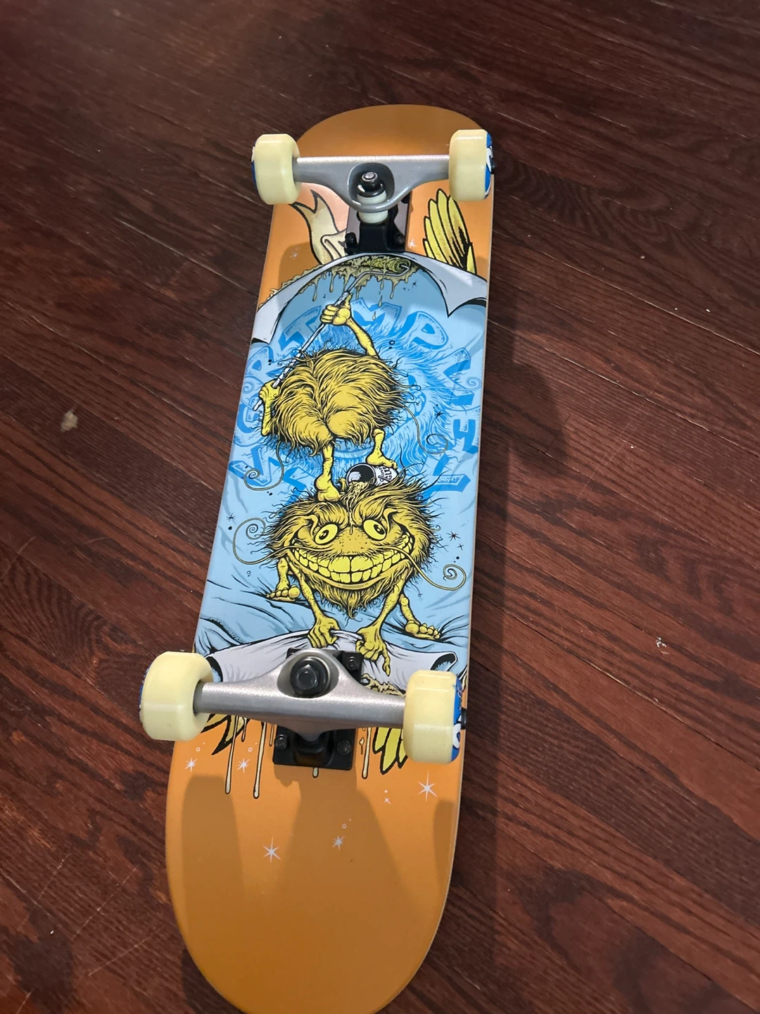 Skateboard with cartoon graphic