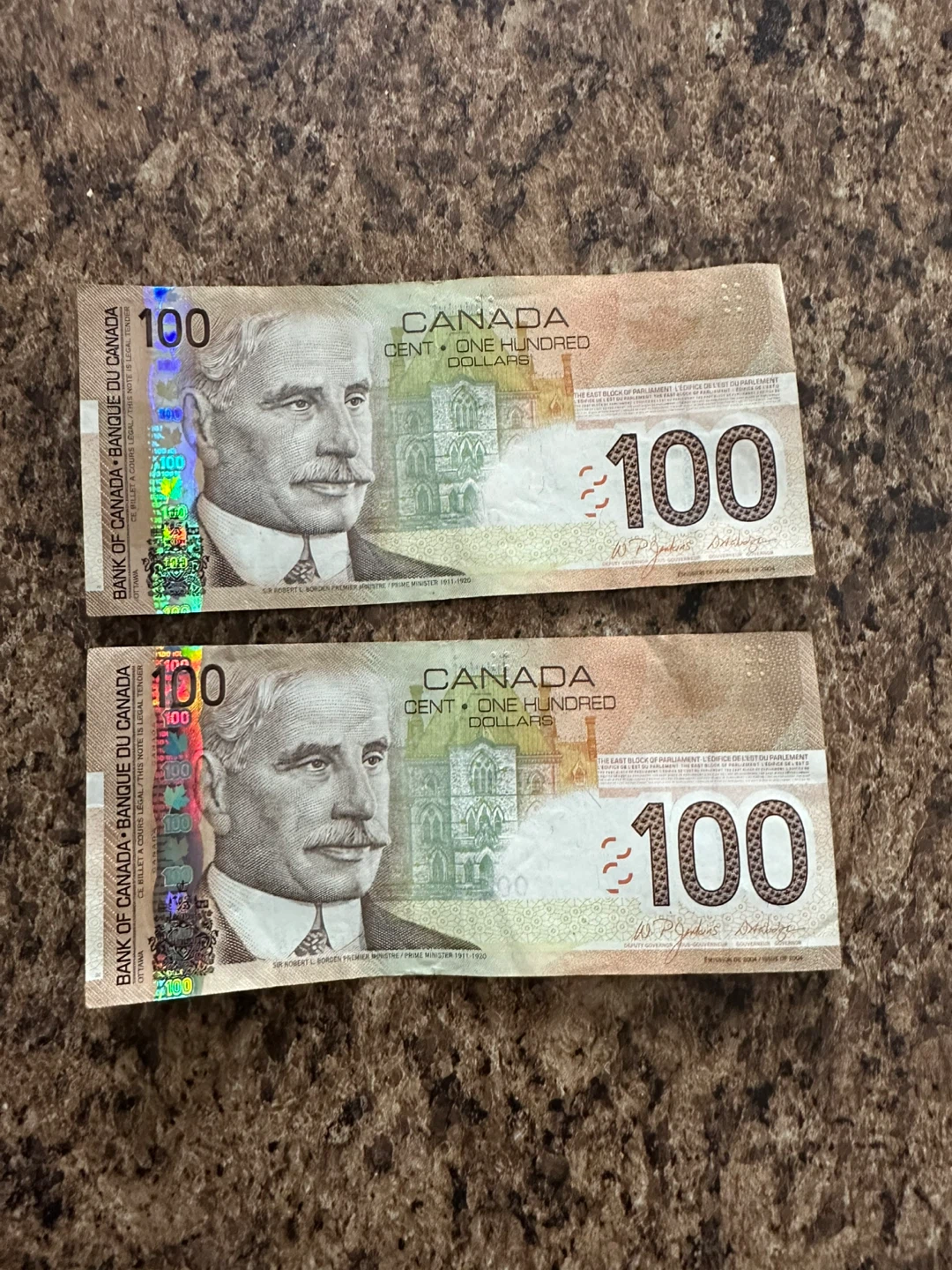 Two $100 Canadian Bank Notes
