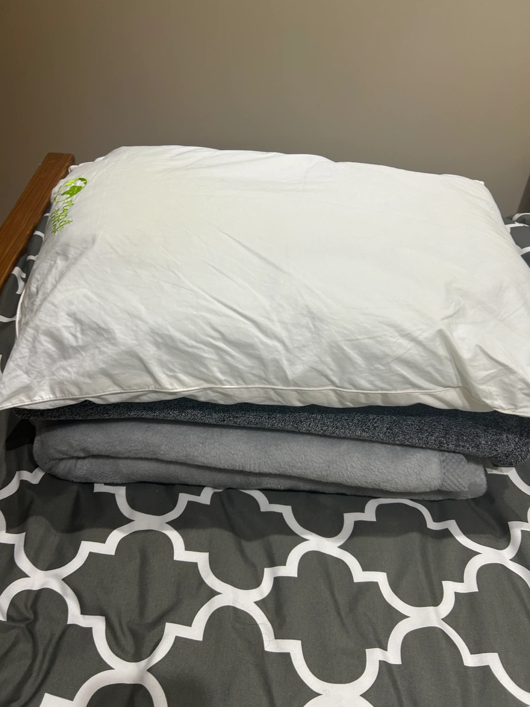 White Pillow and Grey Blankets