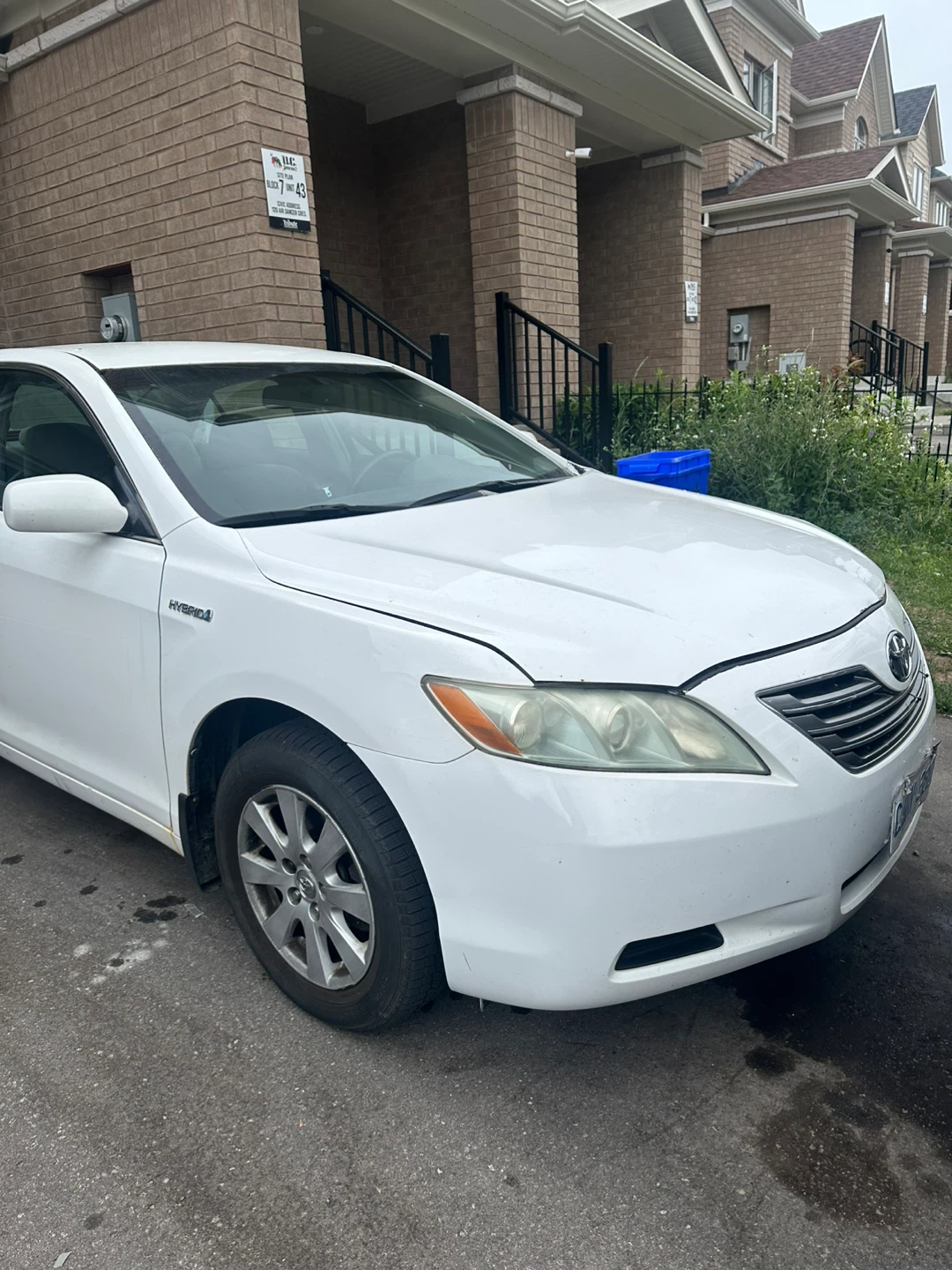White Toyota Camry Hybrid