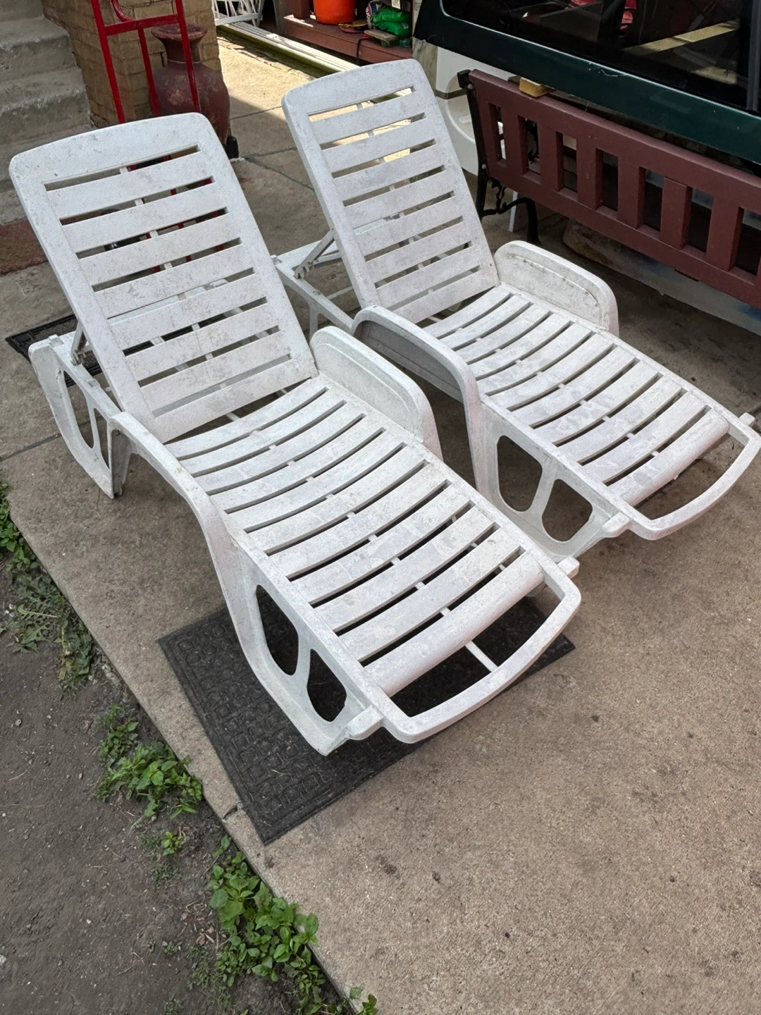 2 White Plastic Chaise Lounge Chairs