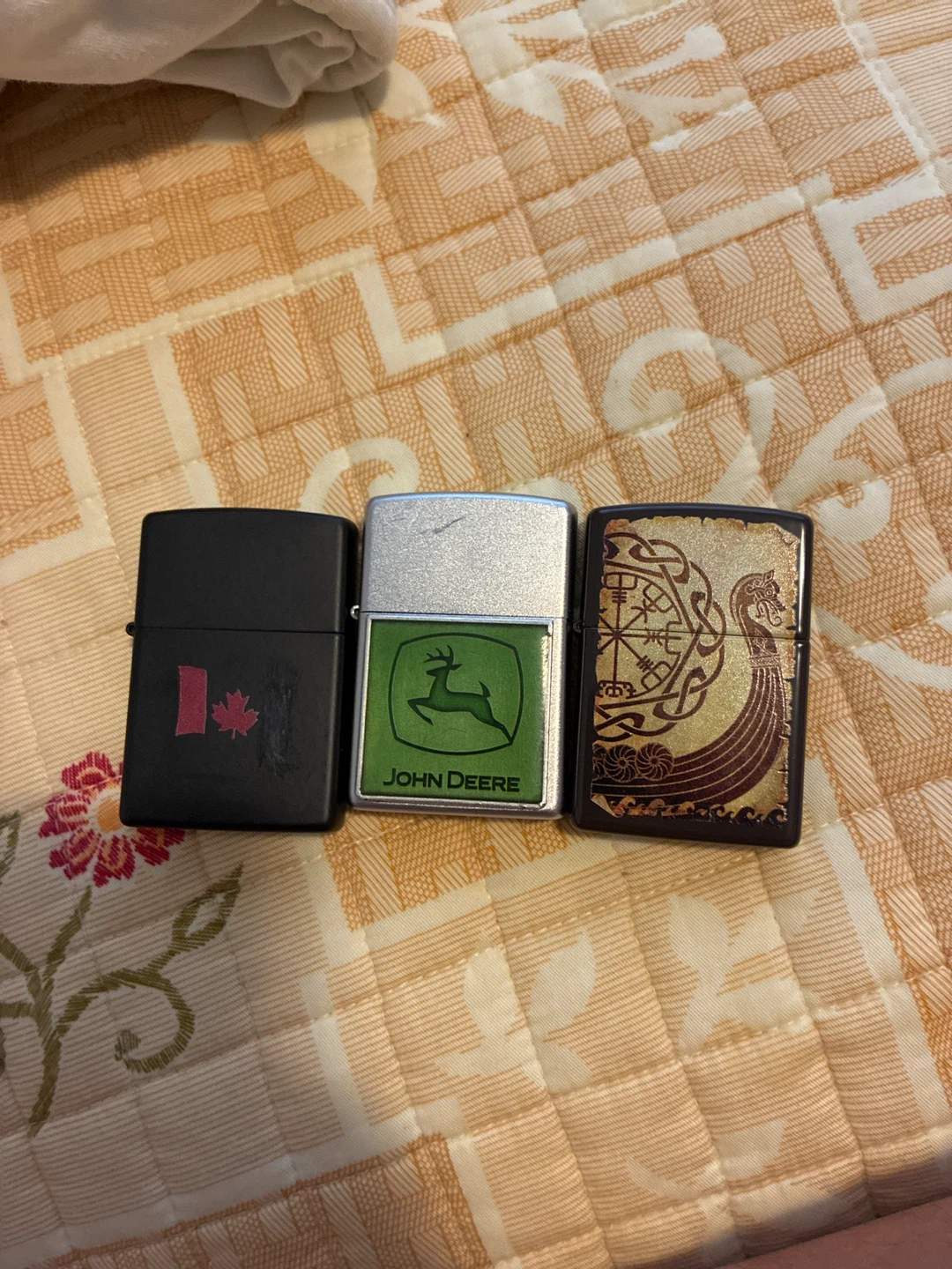 Selling 3 lighters John deer, Canada, and a Viking