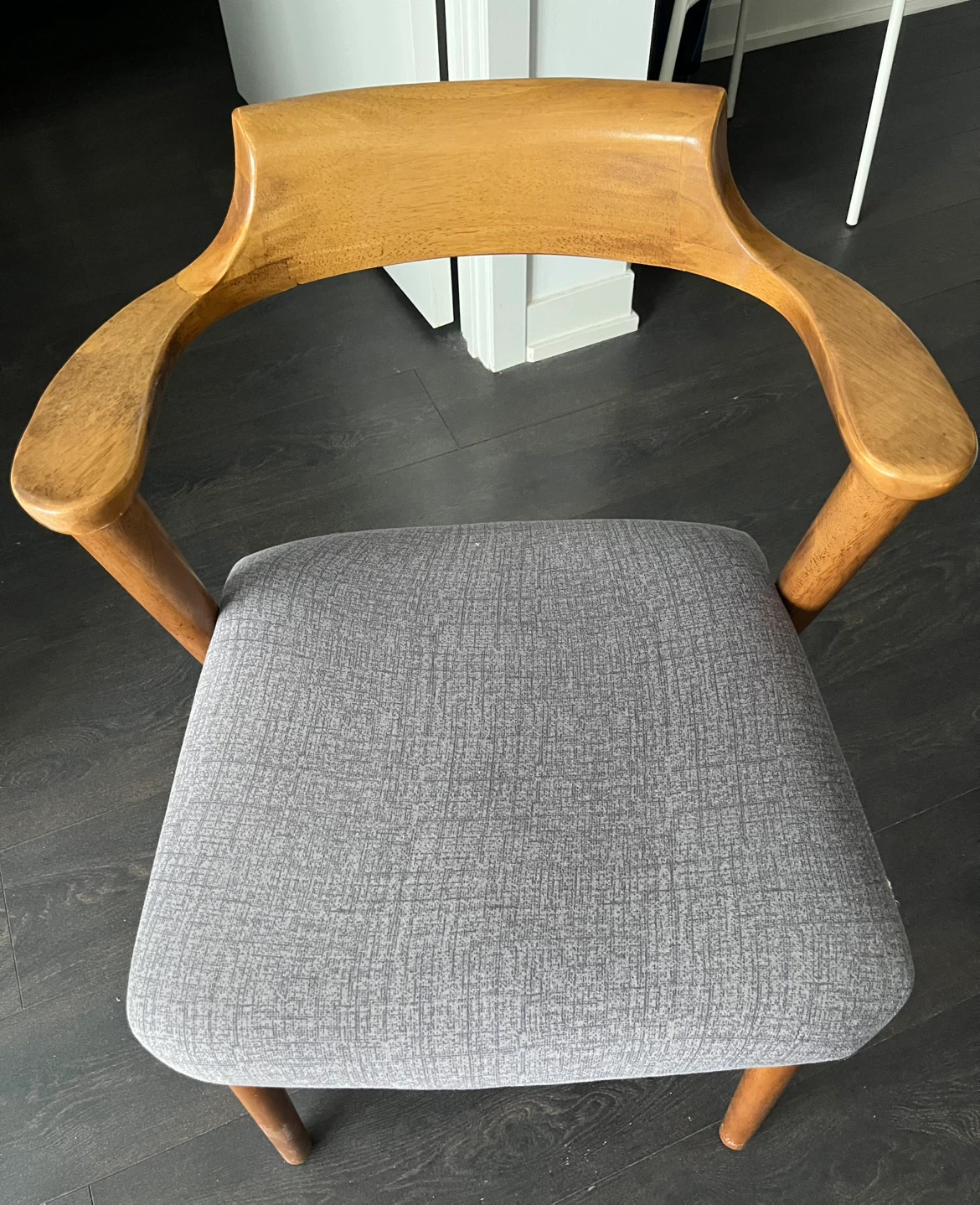 Wooden armchair with grey fabric seat