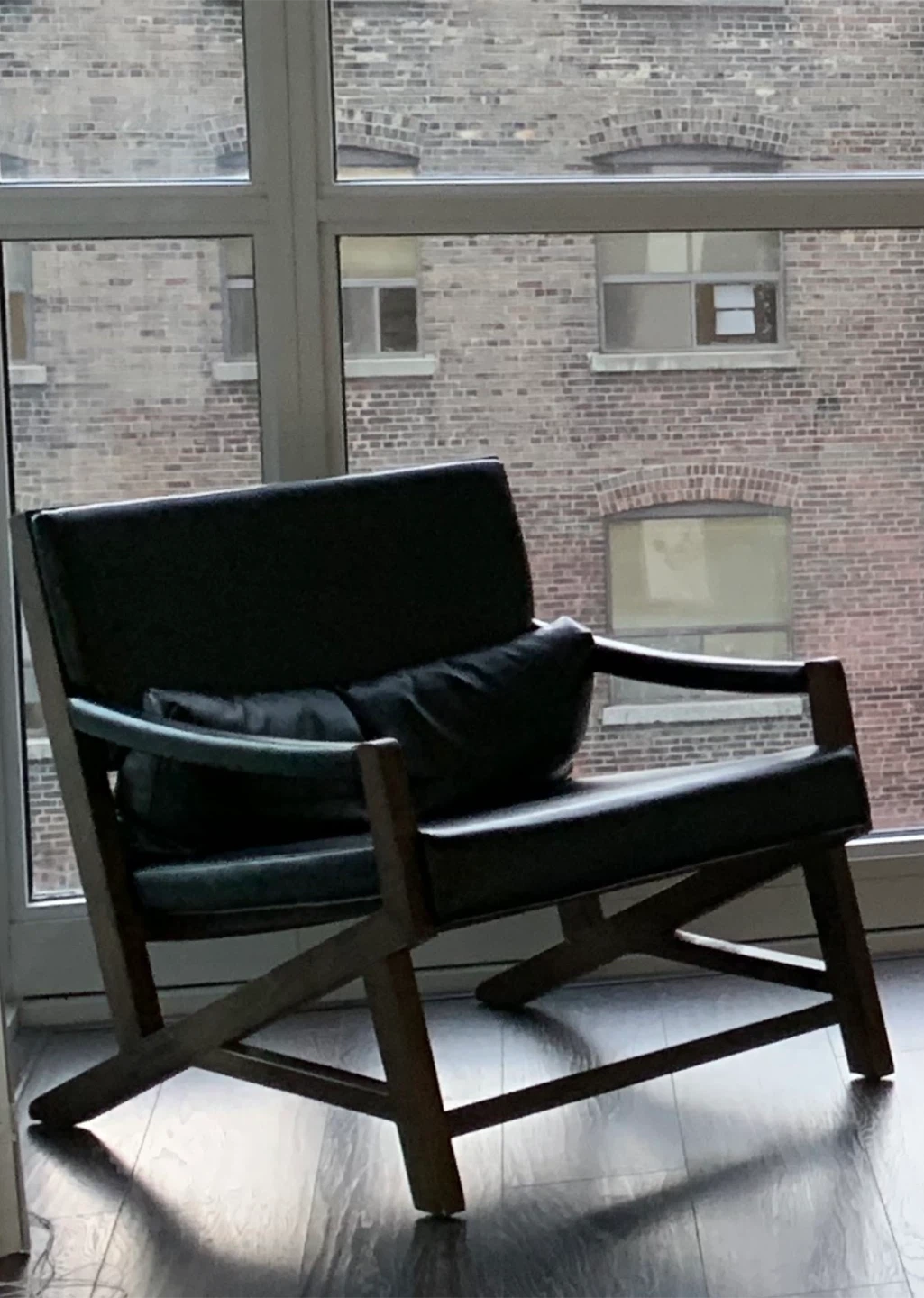 Black Leather Armchair with Magazine Rack Side Table