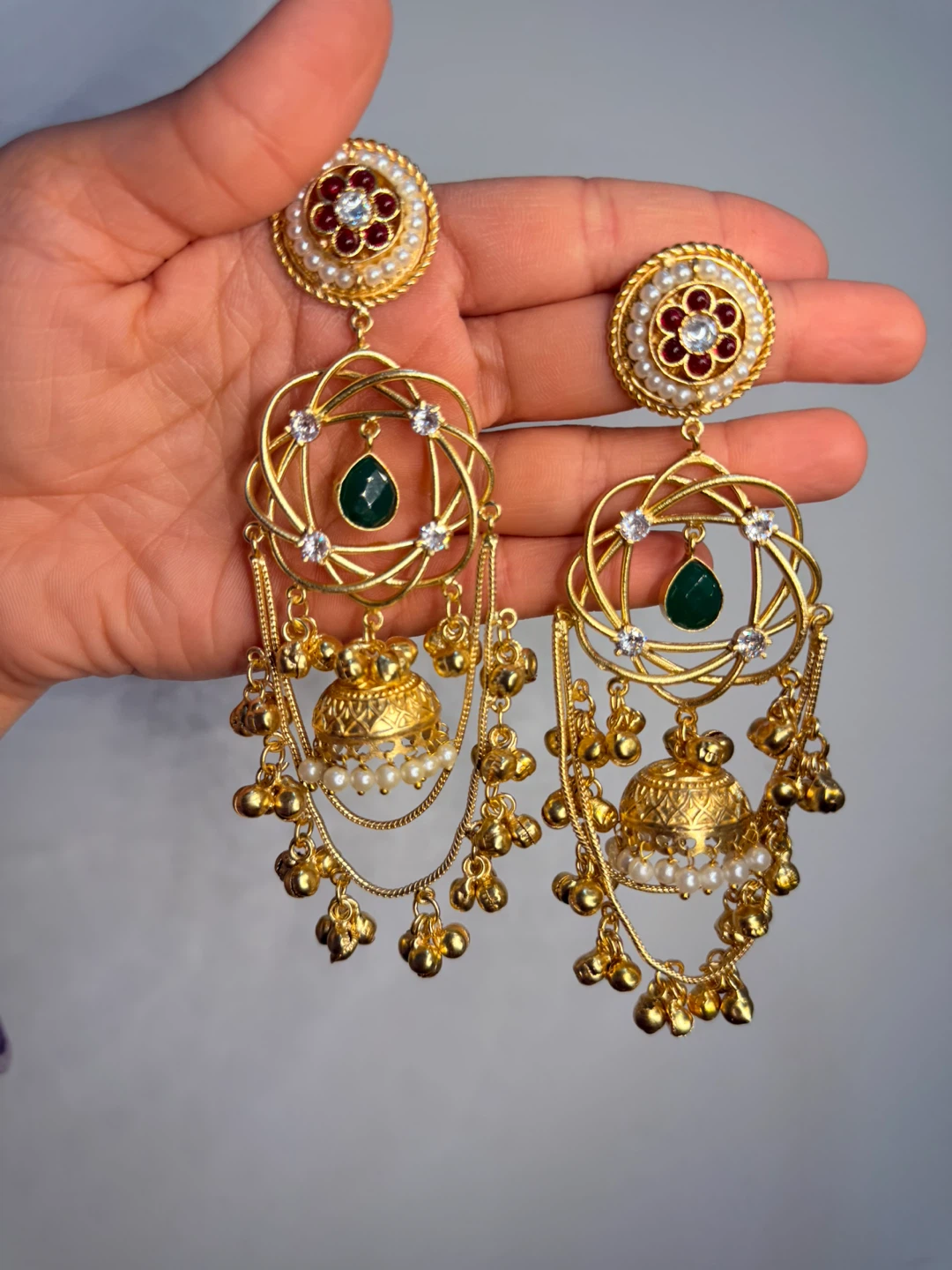 Gold-tone Jhumka Earrings with Green Gemstones and Pearls