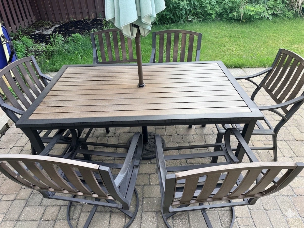 Patio table, chairs, and umbrella set
