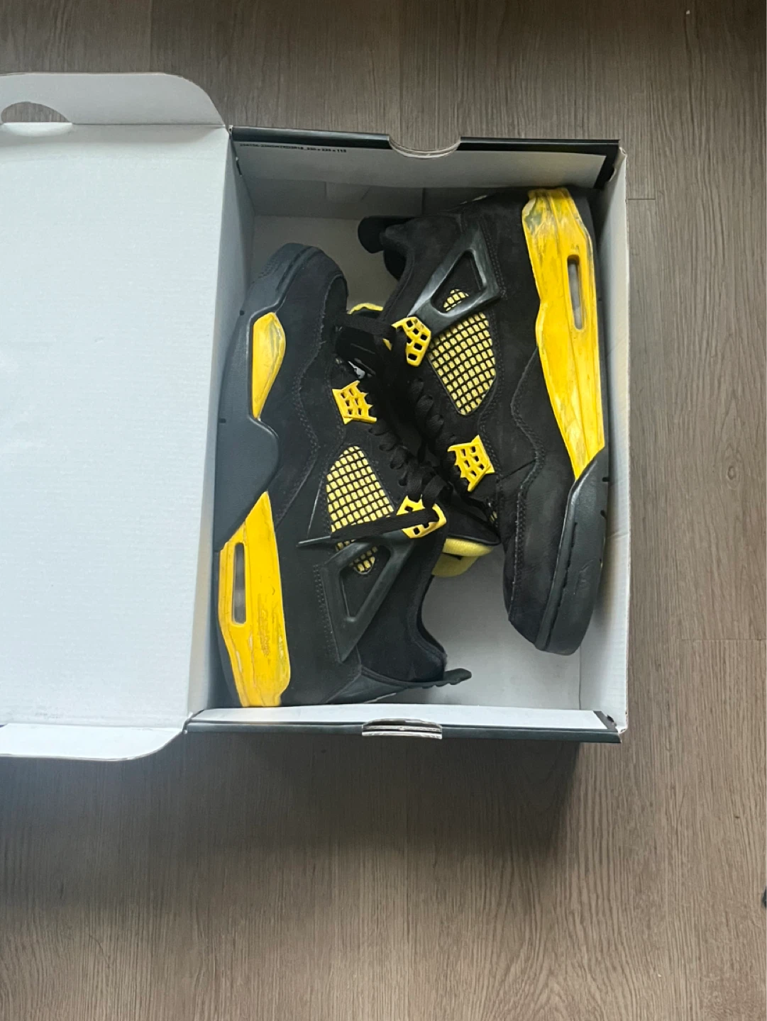 Black and Yellow Jordan 4 Thunder