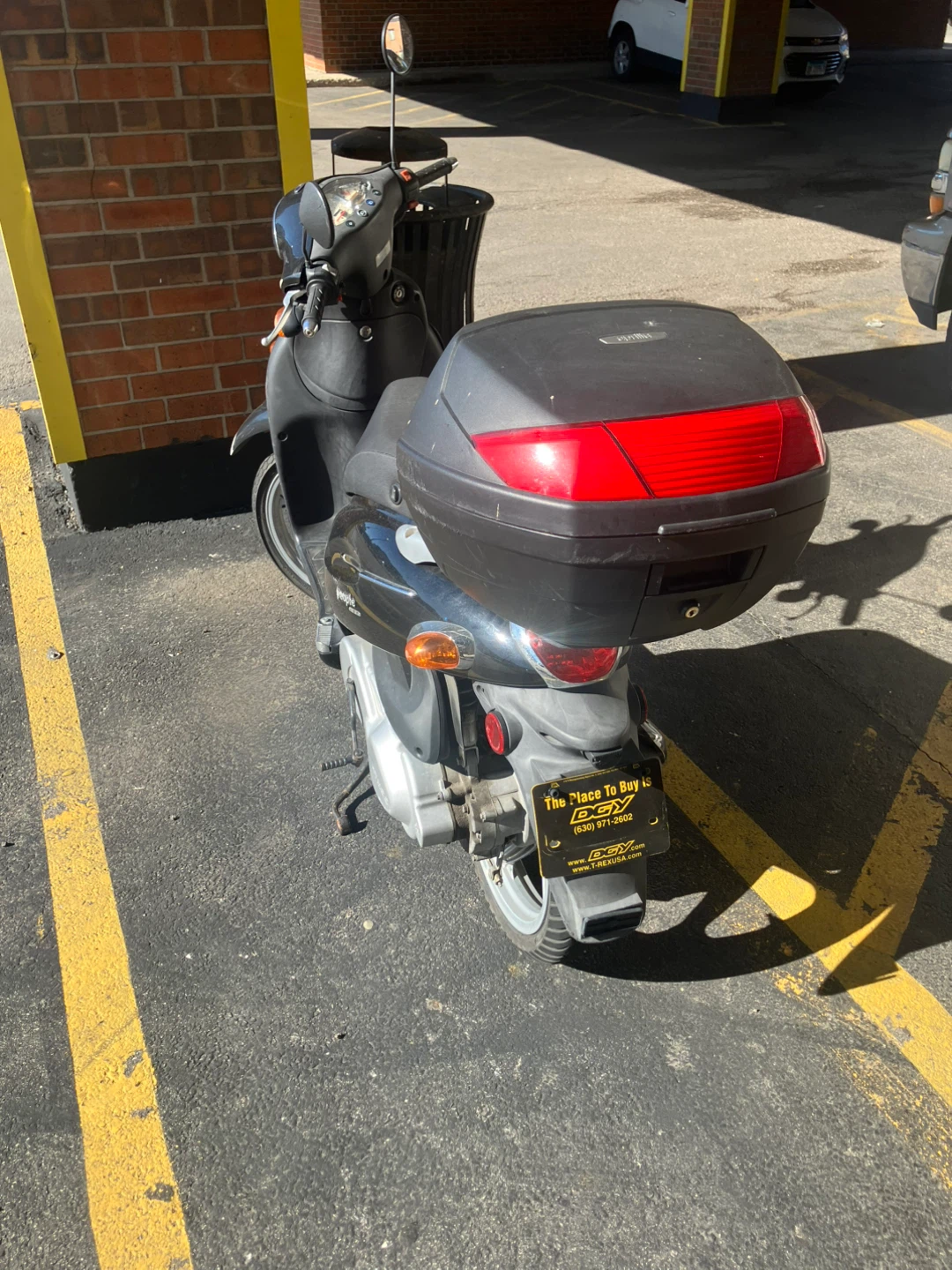 Black Kymco Scooter with Storage Box