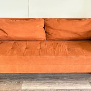 Orange Sofa with Bolster Pillows