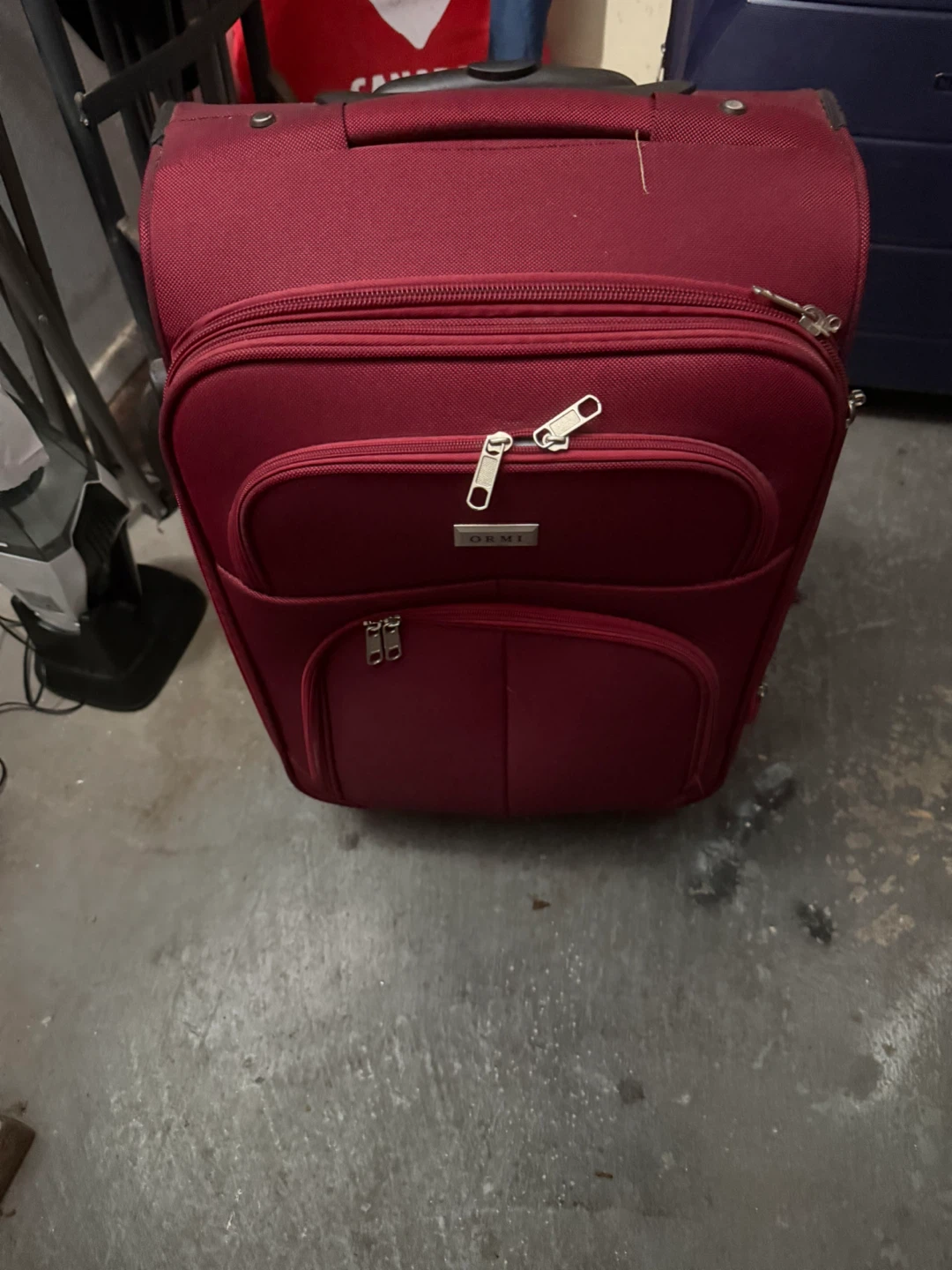 Red carry on suitcase