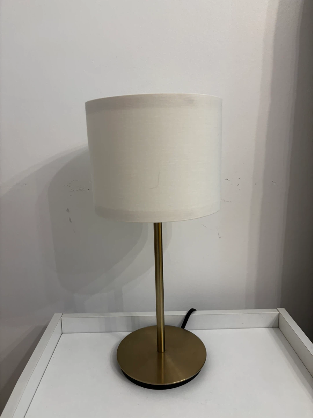 Gold base table lamp with white shade