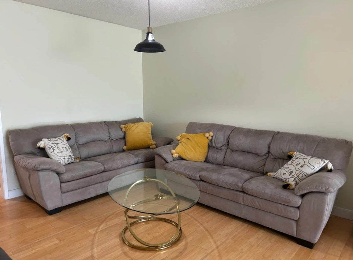Grey Suede Loveseats with Gold Glass Coffee Table