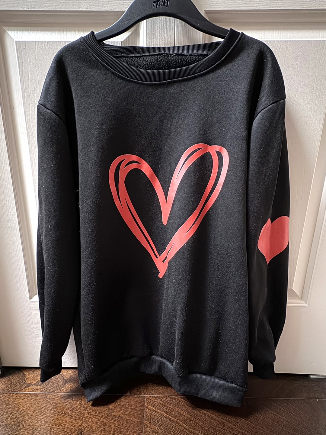 Black Sweatshirt with Red Heart Graphic