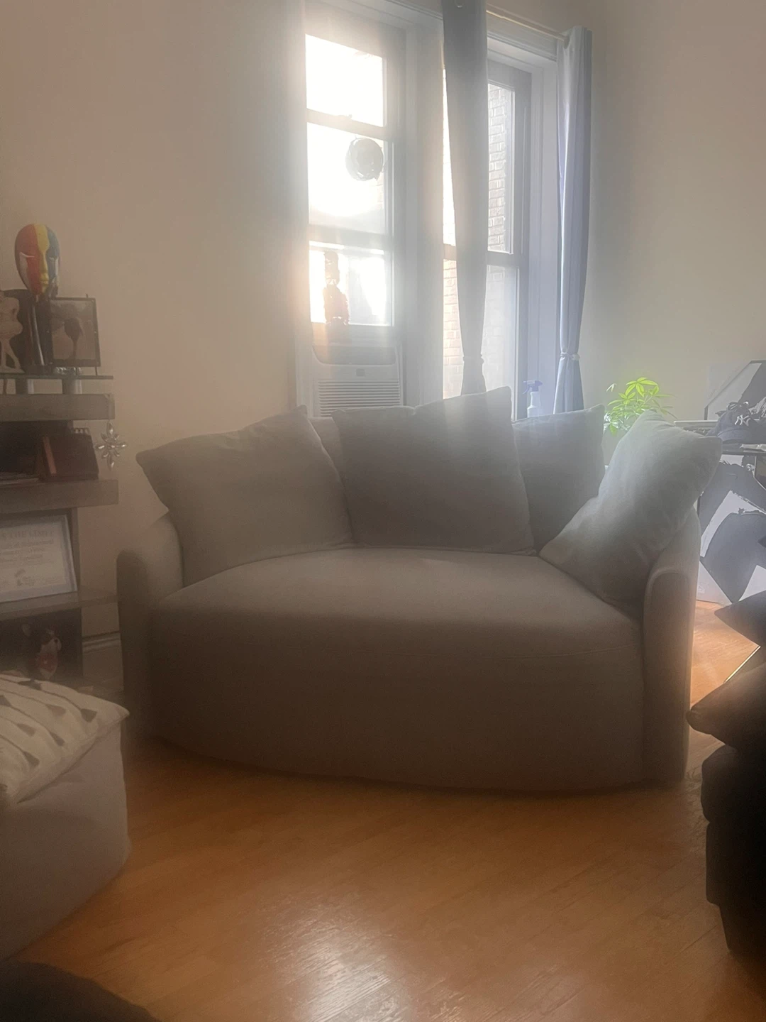 Gray swiveling loveseat