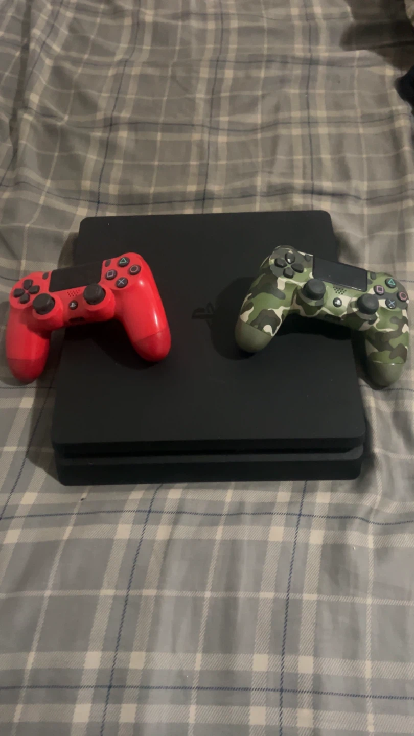 PlayStation 4 Slim Console with Two Controllers