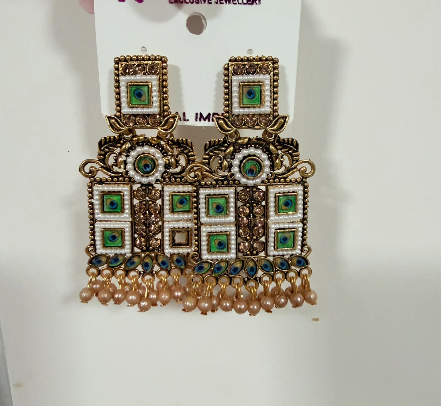 Ornate Gold-Tone Dangle Earrings with Peacock Detail