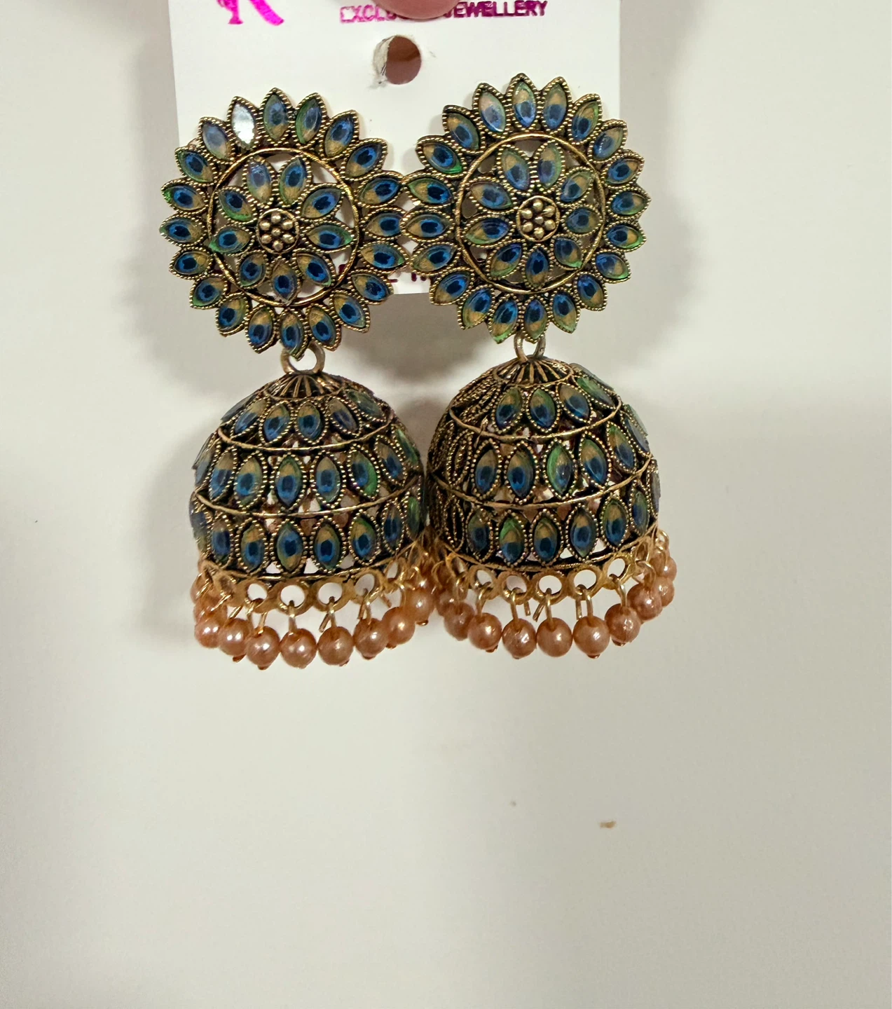 Gold-toned Jhumka Earrings with Blue Peacock Detailing