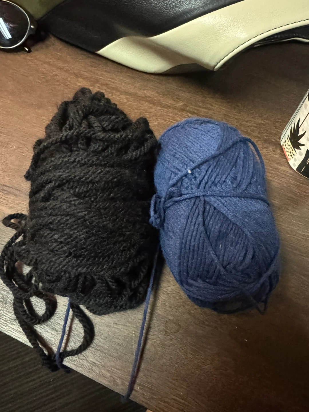 2 skeins of yarn - black and blue