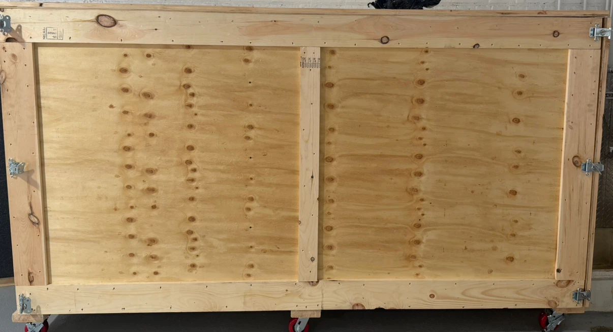 Wooden Crate with Wheels - 105” L x 58” H x 32” W.