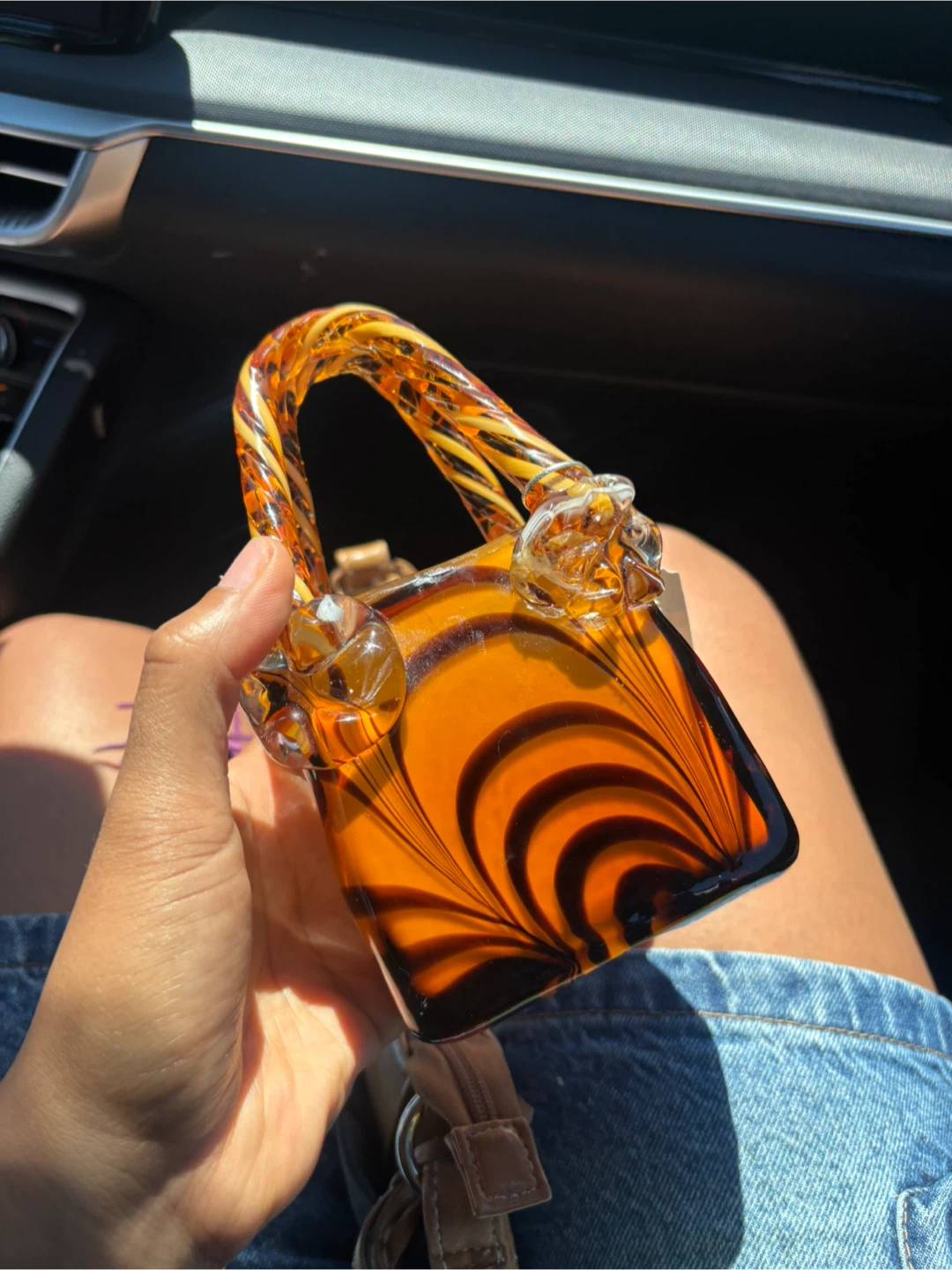 Glass purse with swirled pattern