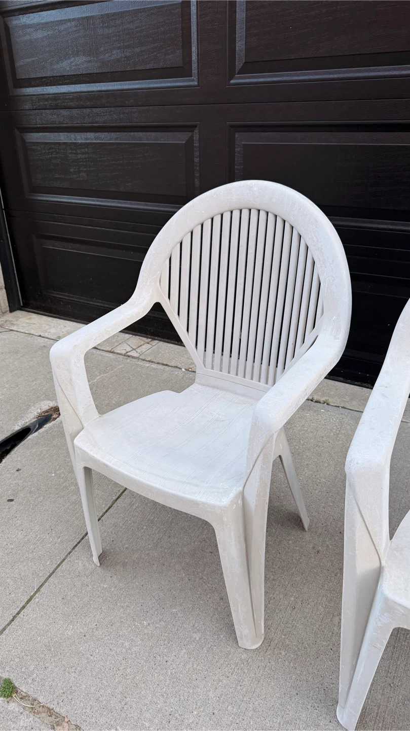 Two white plastic patio chairs - photo 2