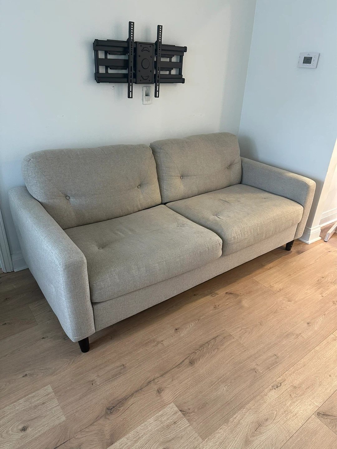 Greige tufted condo size couch