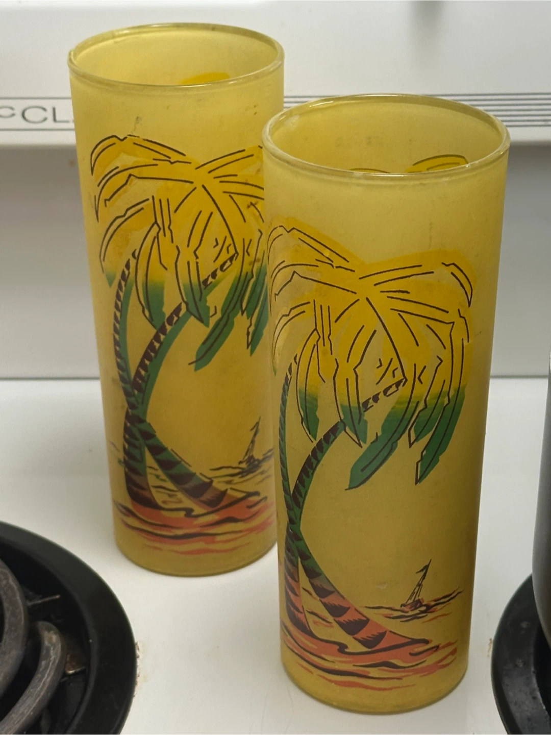 Pair of mid century Tom Collin’s palm tree glasses