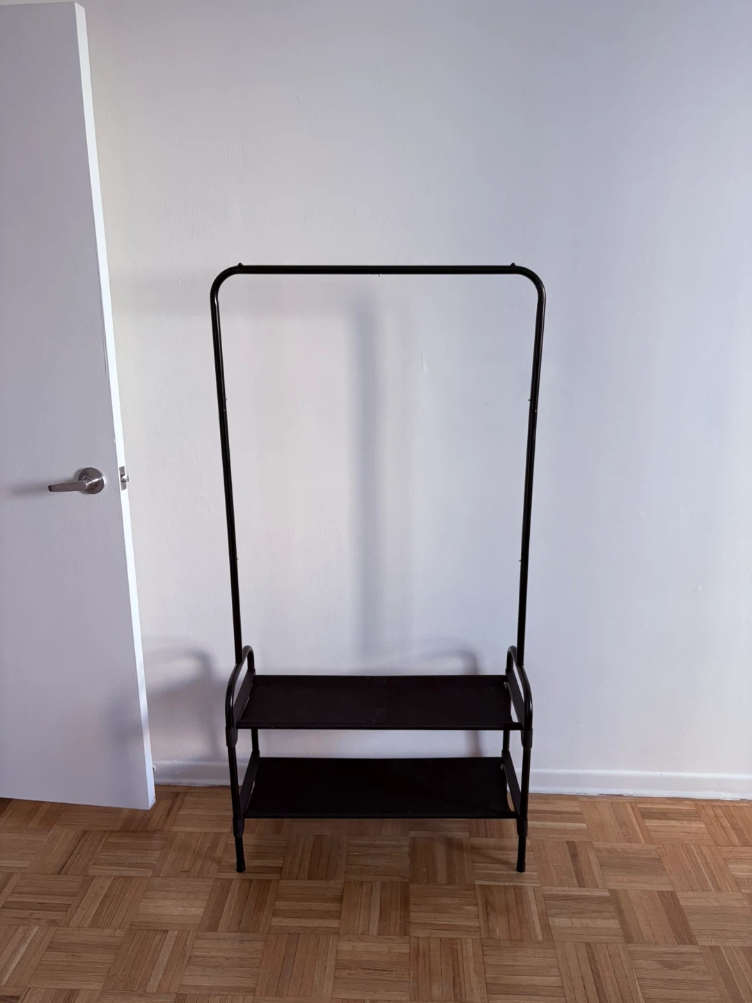 Black garment rack with two shelves