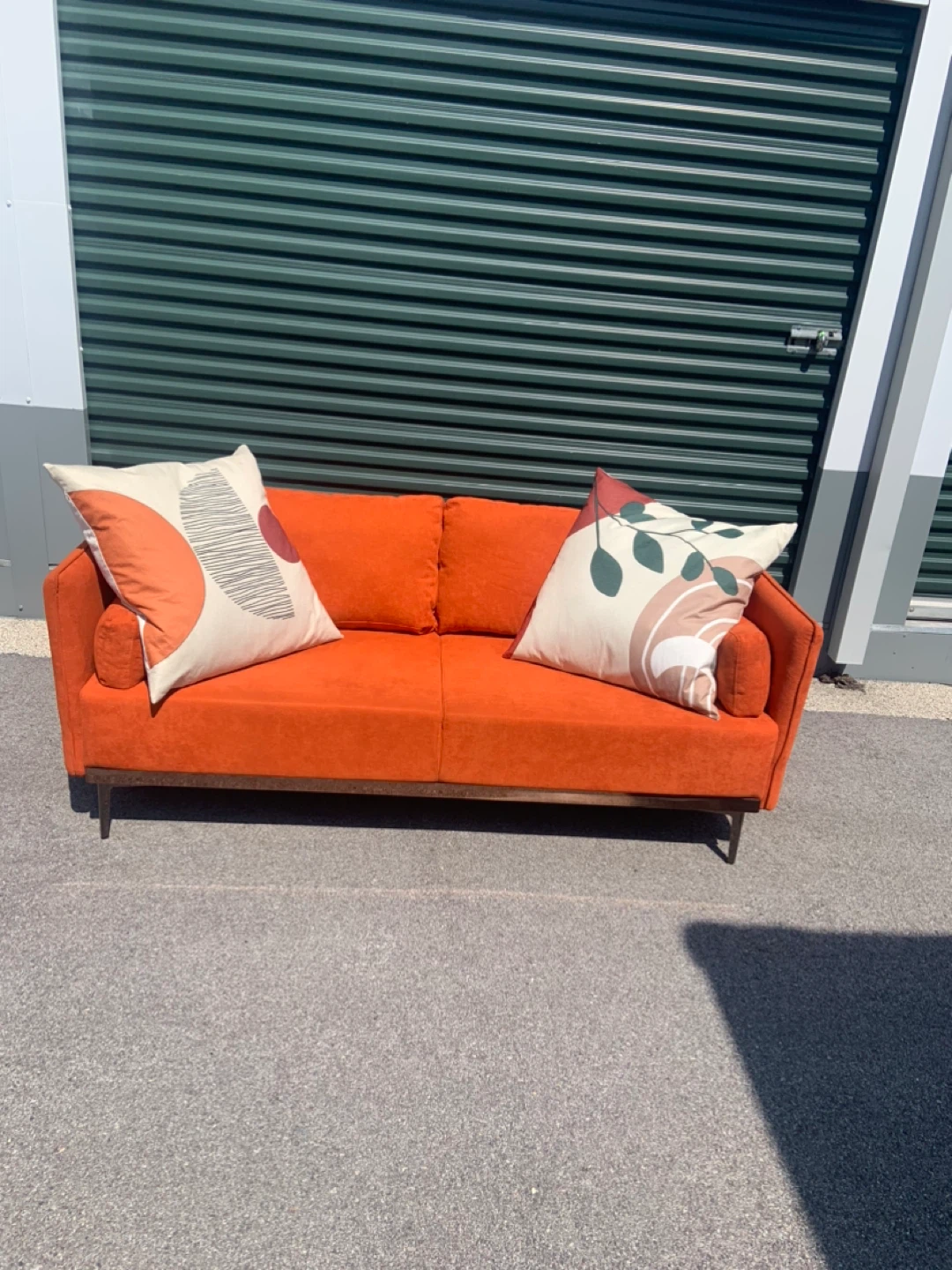 Orange Loveseat Sofa with Decorative Pillows