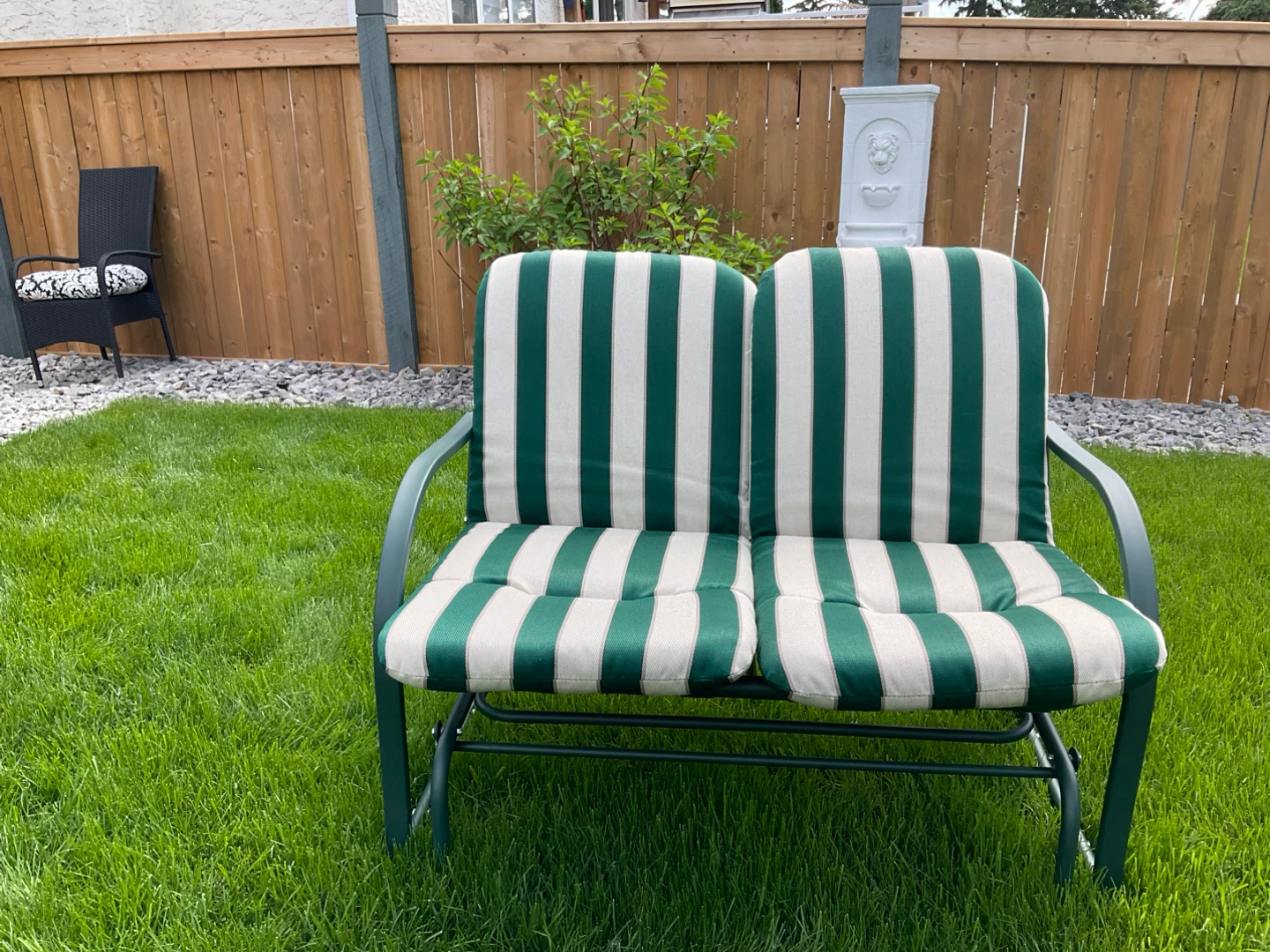 Green and beige striped outdoor glider chair cushions