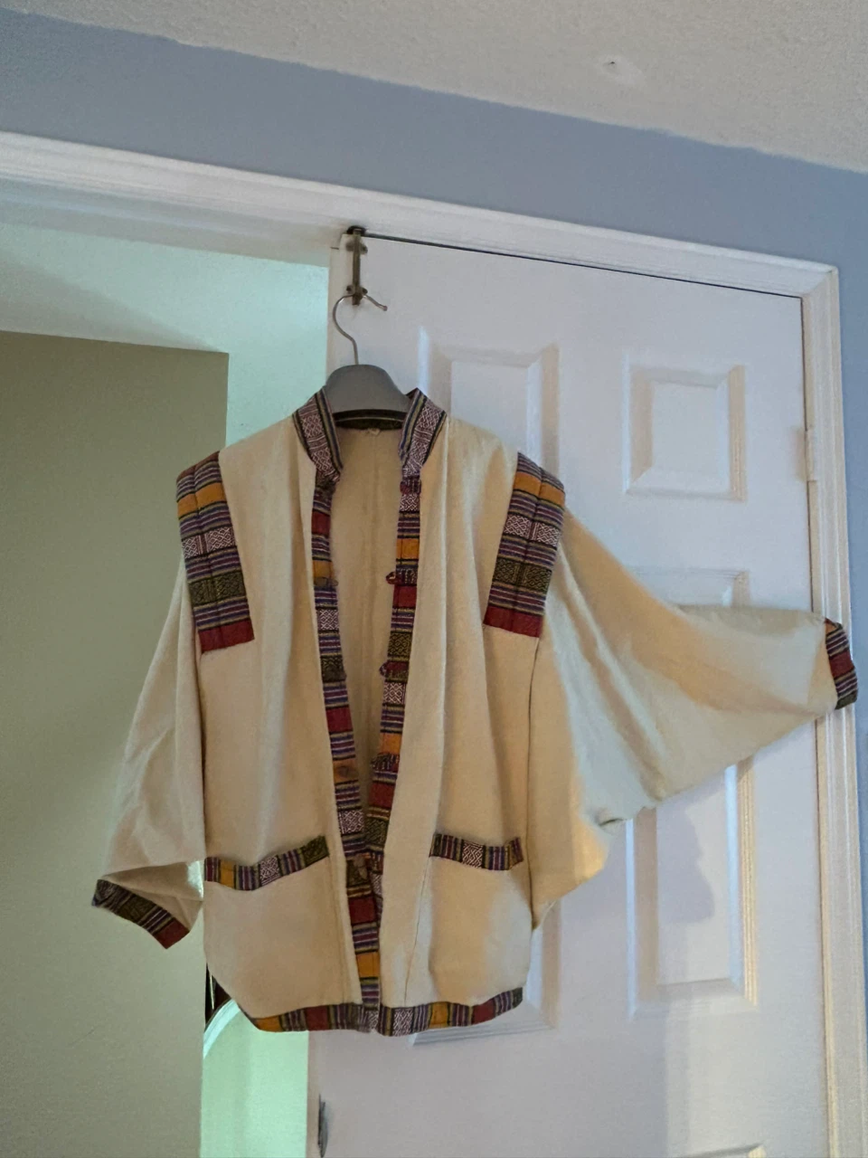 Cream jacket from Nepal with Colourful Trim
