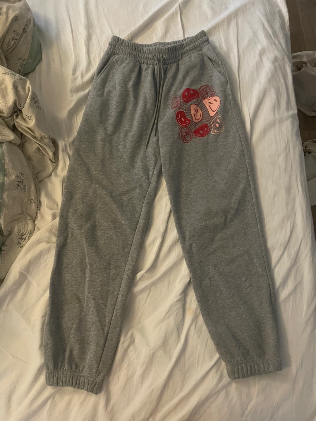 grey smiley graphic sweatpants