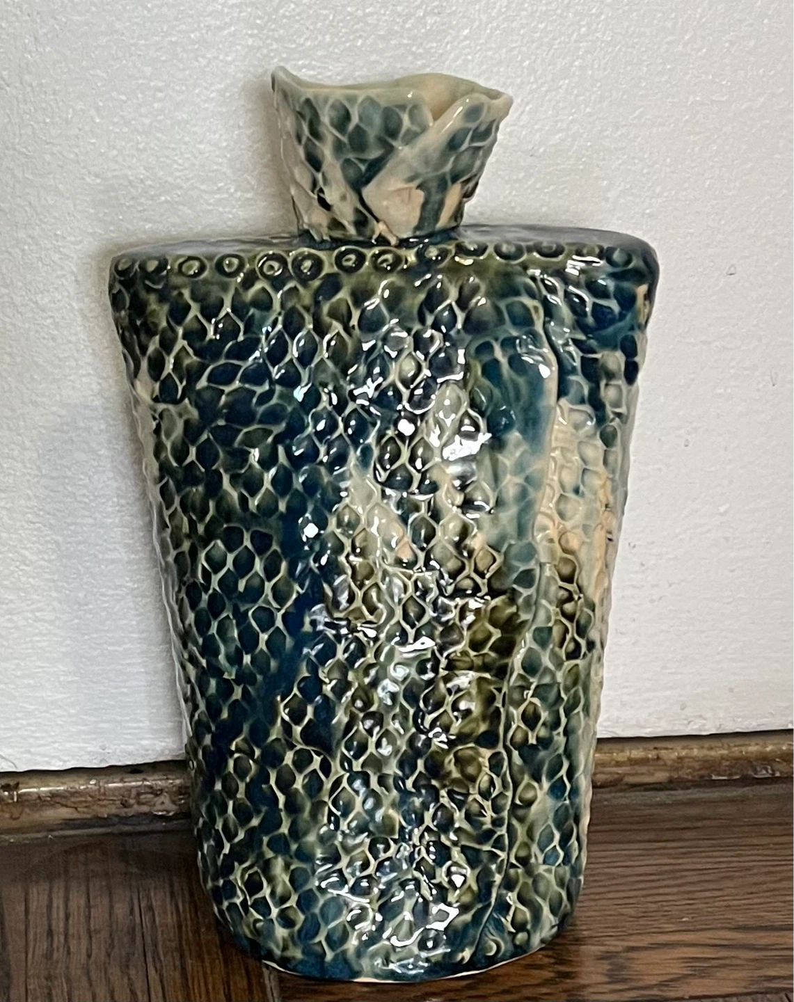 Glazed fish scale pottery vase with fold detail
